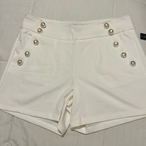 White and gold buttoned shorts